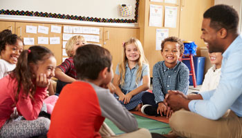 An educator teaching young students