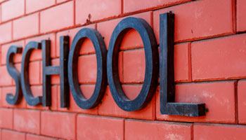 School logo on brick