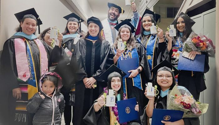 San Jose State University critical bilingual authorization 2023 graduates with faculty members, Eduardo R. Muñoz-Muñoz and Ana Ramírez.